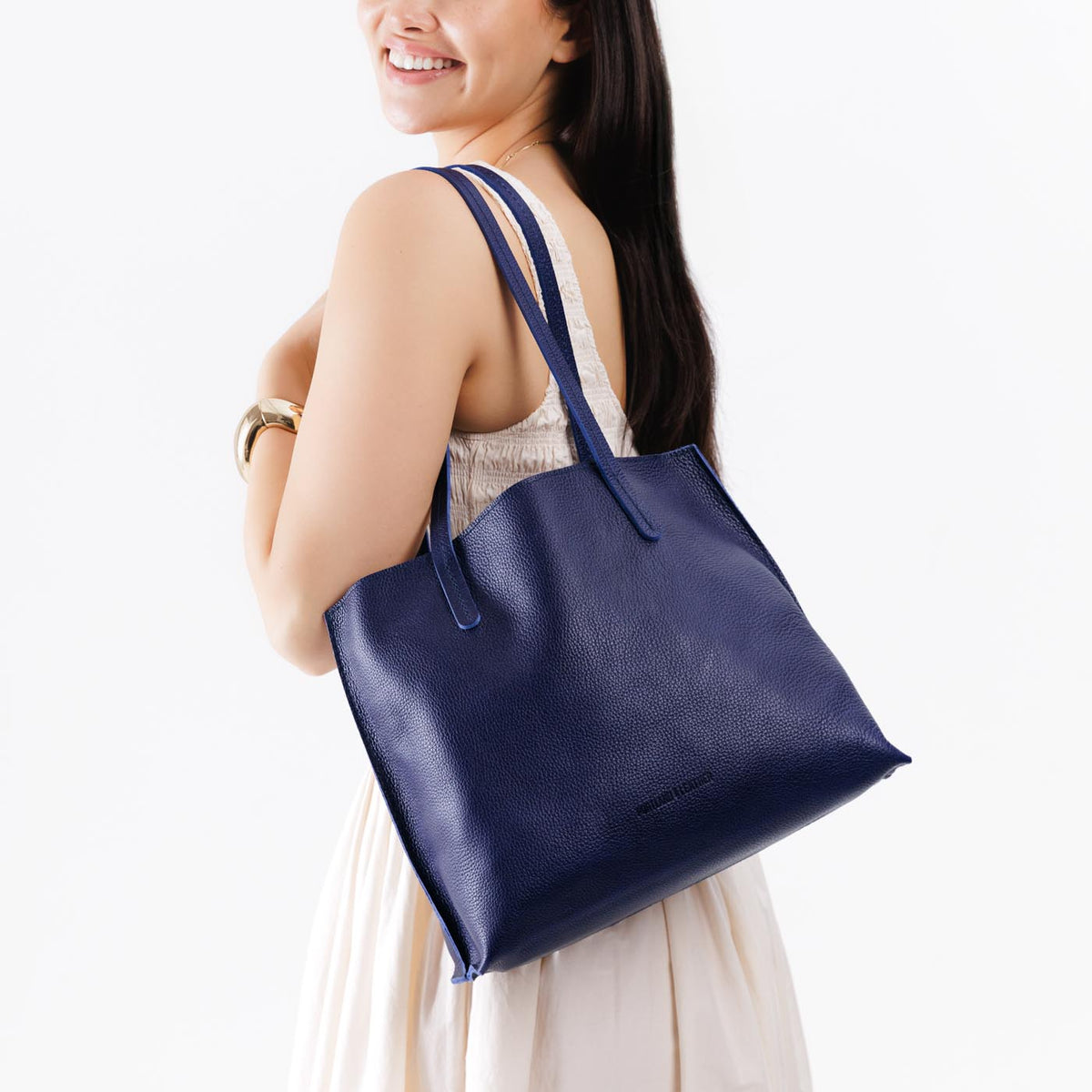 Cobalt*Medium | Model holding leather tote bag with interior snap key loop