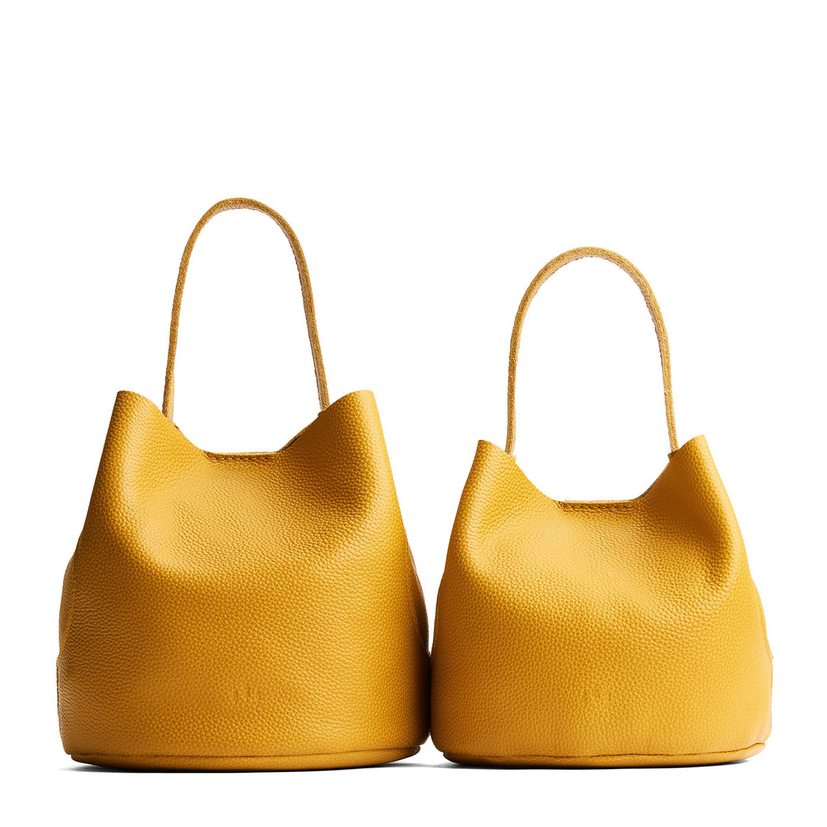 Sunshine | Size comparison image of two symmetrical leather bucket bags