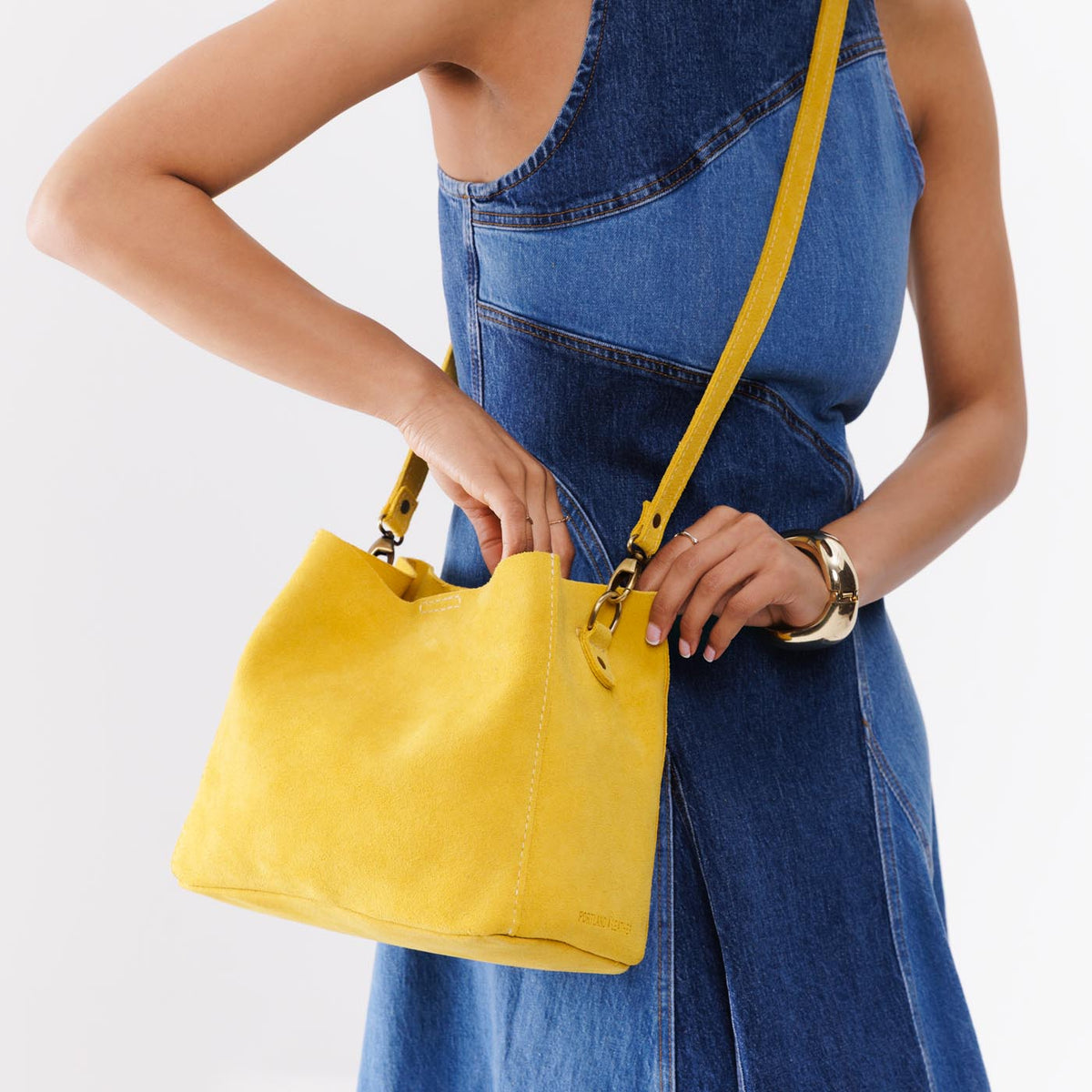 Hello Yellow | symmetrical bucket bag with latch closure and removable crossbody strap