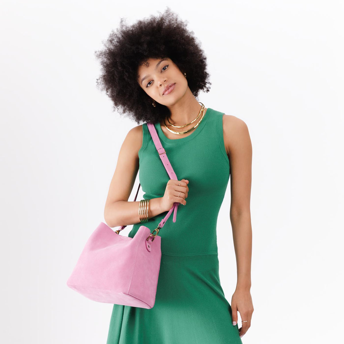 Pink Suede | symmetrical bucket bag with latch closure and removable crossbody strap