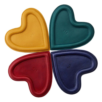 All Variants | Four heart shaped leather trays with stuffed edges