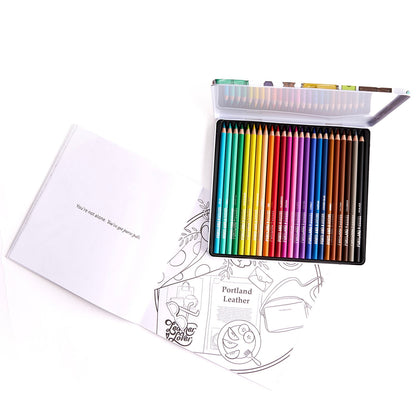 Set of colored pencils in a metal case with a coloring book on a white background.