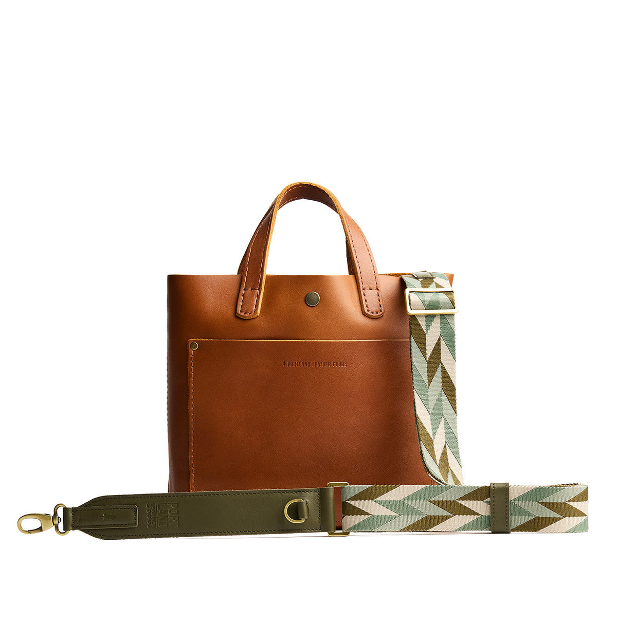 Everfield | Patterned fabric and leather strap attached to leather purse on a white background