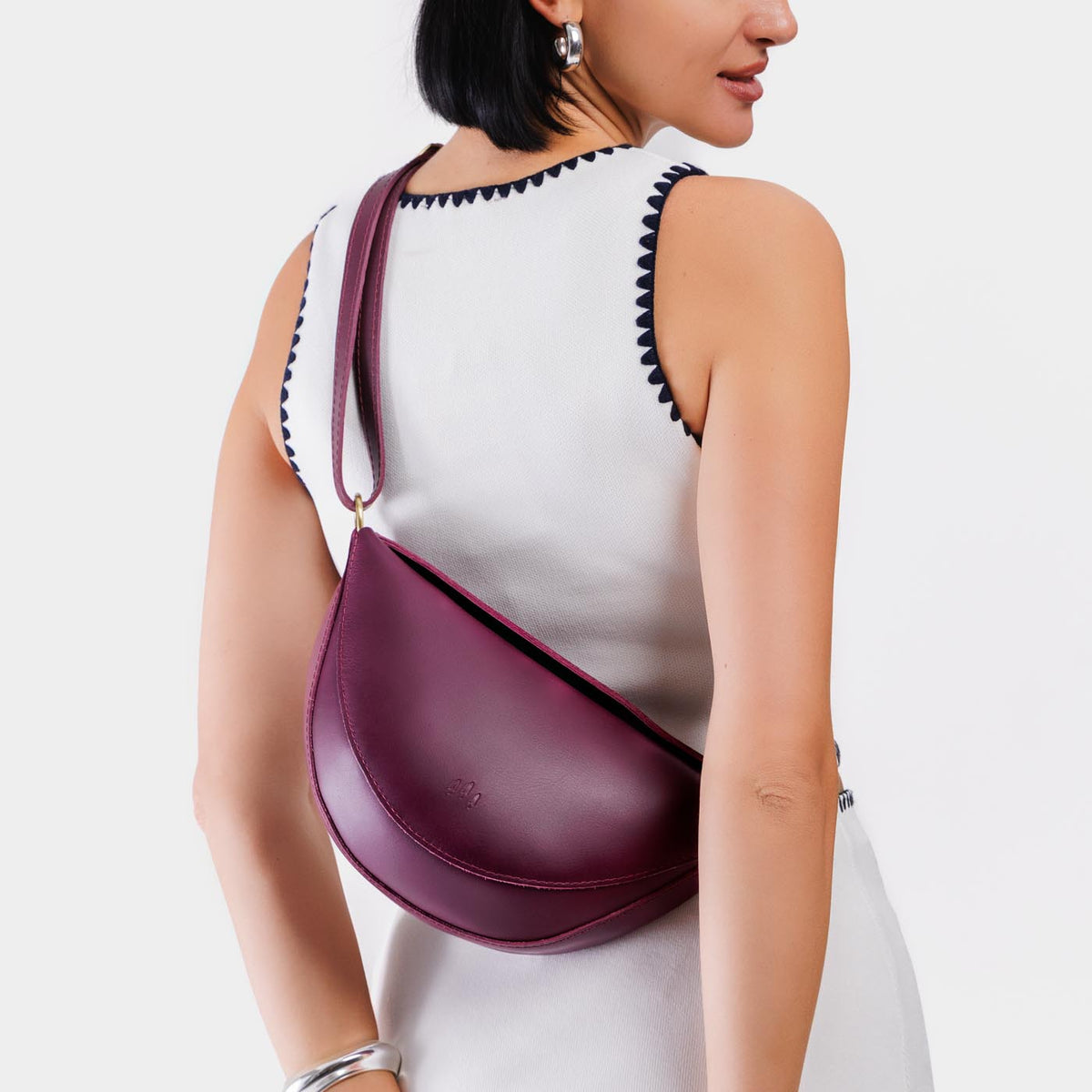 Lollipop*Medium | Model wearing half circle shaped sling bag