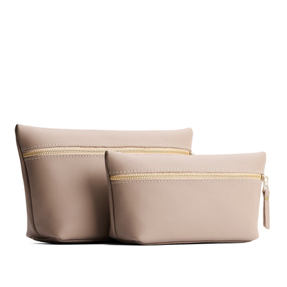 Stone | Two large leather makeup bags with zipper