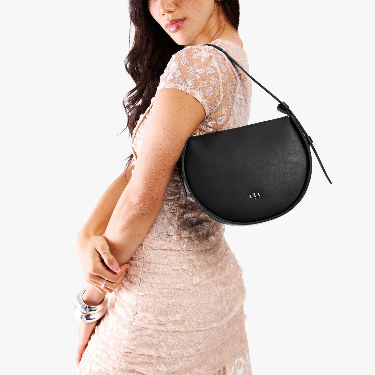 Black | Model wearing a rounded structured shoulder bag