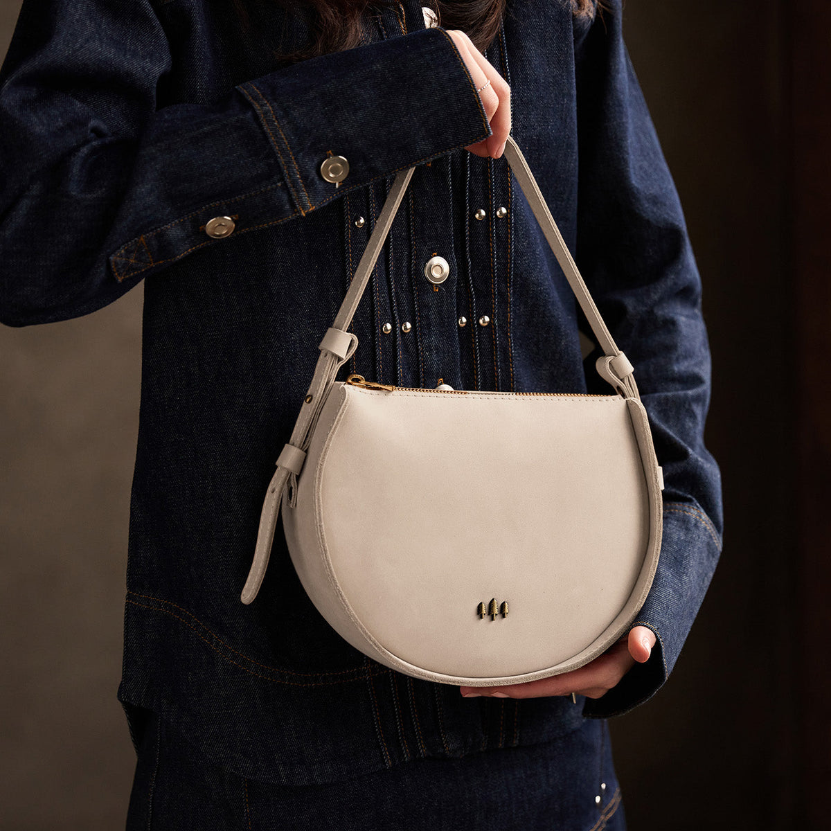 Dragon Bone | Model wearing a rounded structured shoulder bag