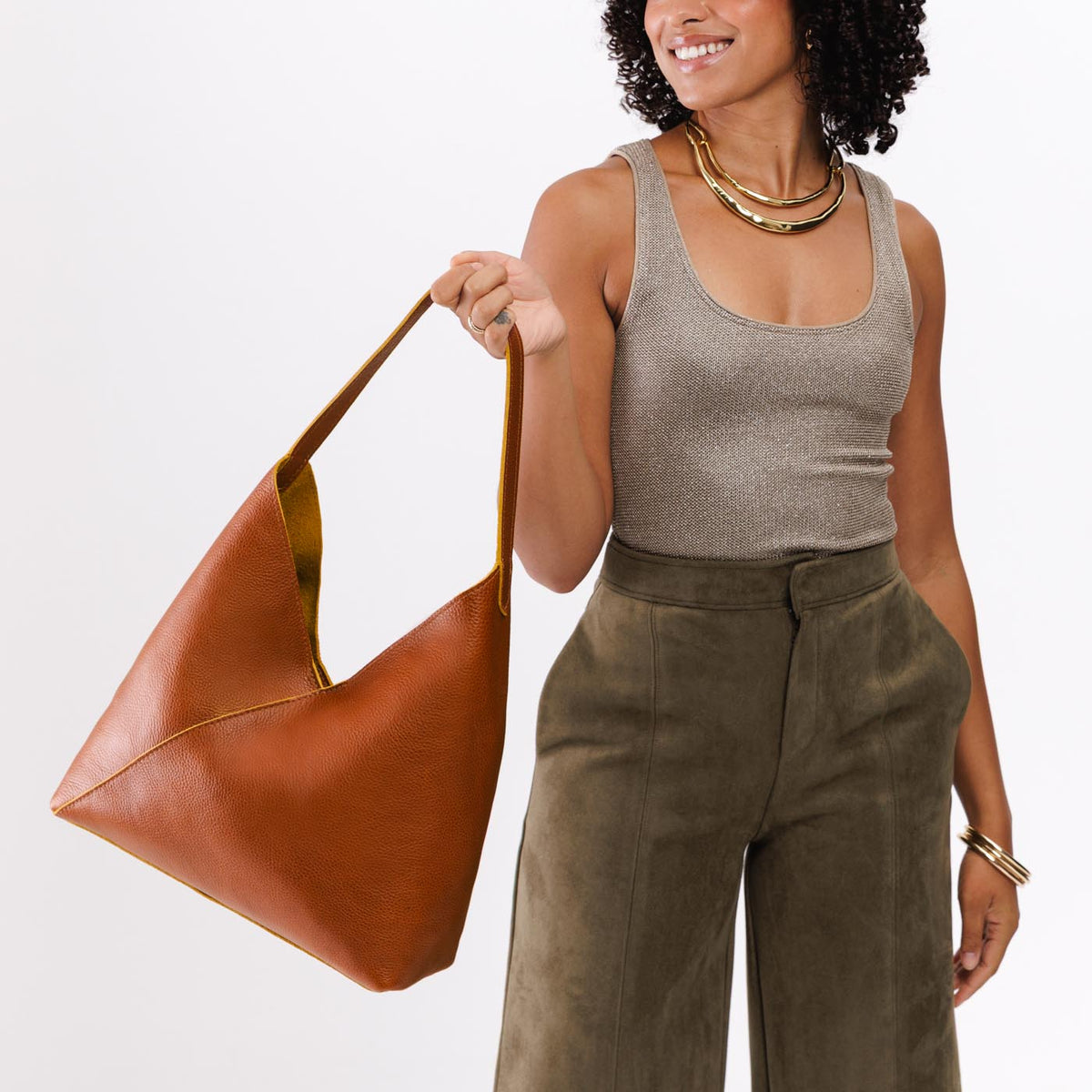 Sienna*Oversized | Model holding large shoulder bag with magnetic snap closure