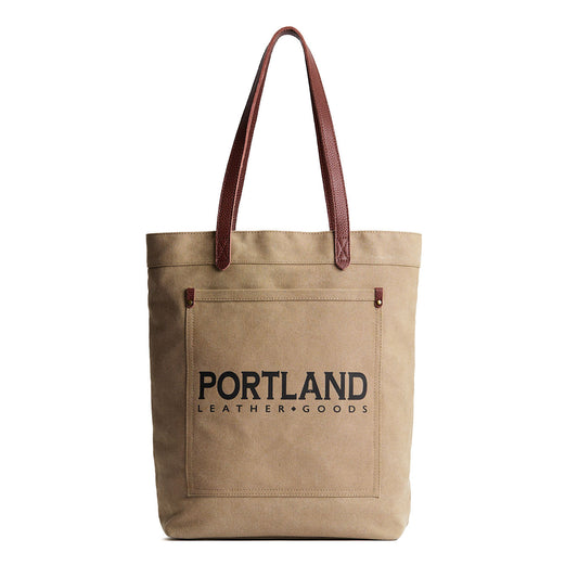 Beige tote bag with leather handles and 'Portland Leather Goods' text