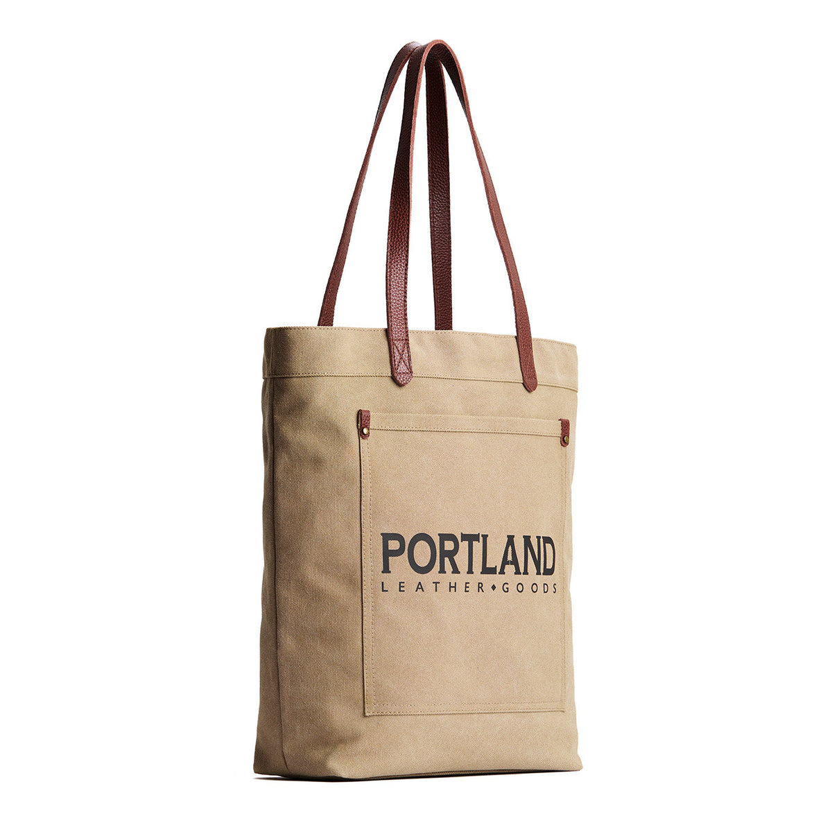 Beige tote bag with leather handles and 'Portland Leather Goods' text