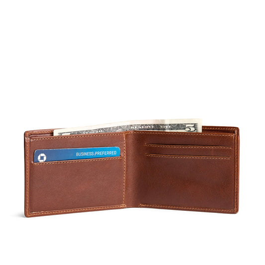 Saddlestone | Bifold leather wallet with card slots open with card and cash inside