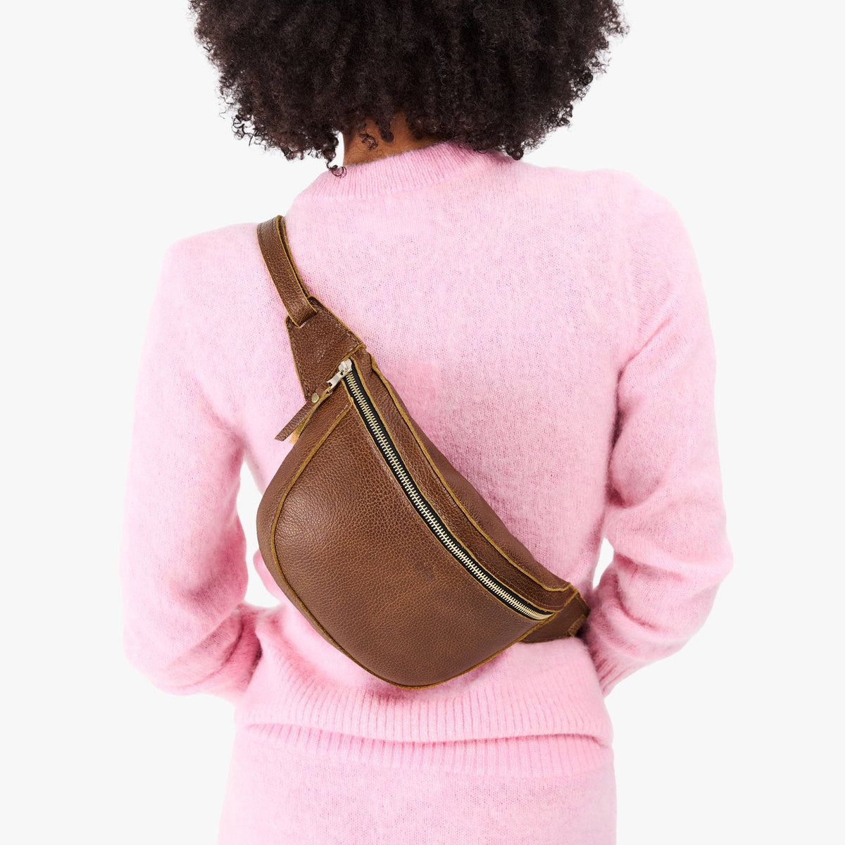 Asheville | Model wearing a sling bag with front zipper