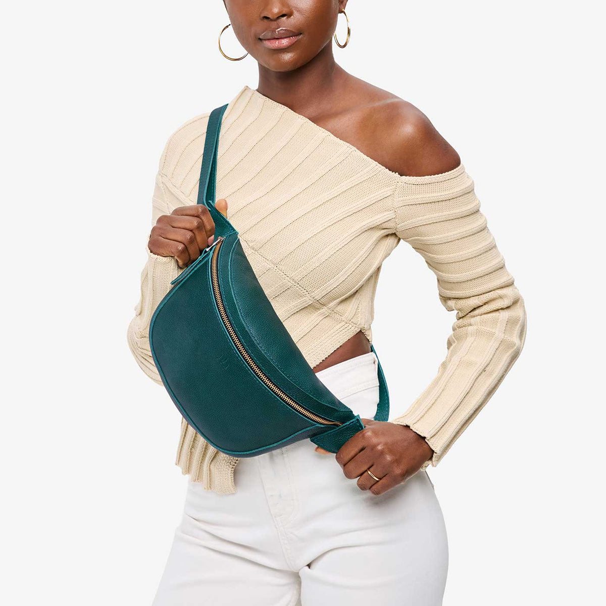 Sea Glass | Model wearing a sling bag with front zipper