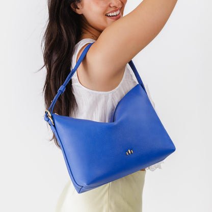 Astro Blue*Large | Medium sized slouchy leather shoulder bag with zipper opening and three metal tree emblems