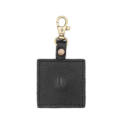 Pebbled--black | Square-shaped leather AirTag holder with snap closure and swivel lobster claw clasp