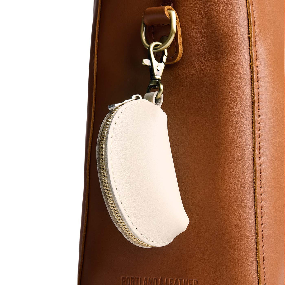 Bone | Taco shaped leather pouch with zipper and swivel lobster clasp on bag