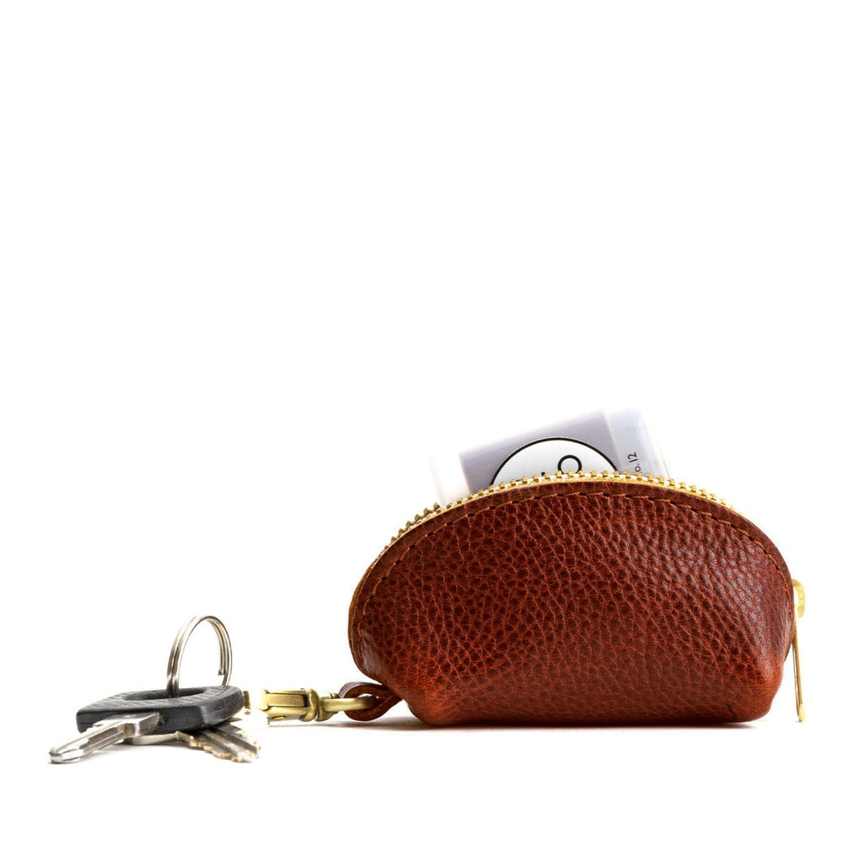 Nutmeg | Taco shaped leather pouch with zipper and swivel lobster clasp on white background