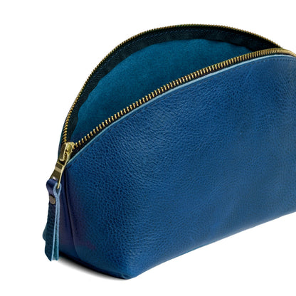 Caspian | Spacious leather makeup bag with curved seams and top zipper open