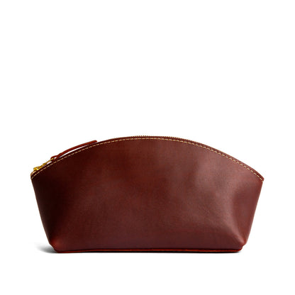 Cognac*Total Eclipse | Spacious leather makeup bag with curved seams and top zipper