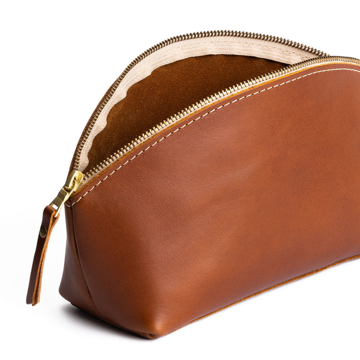 Honey | Spacious leather makeup bag with curved seams and top zipper open