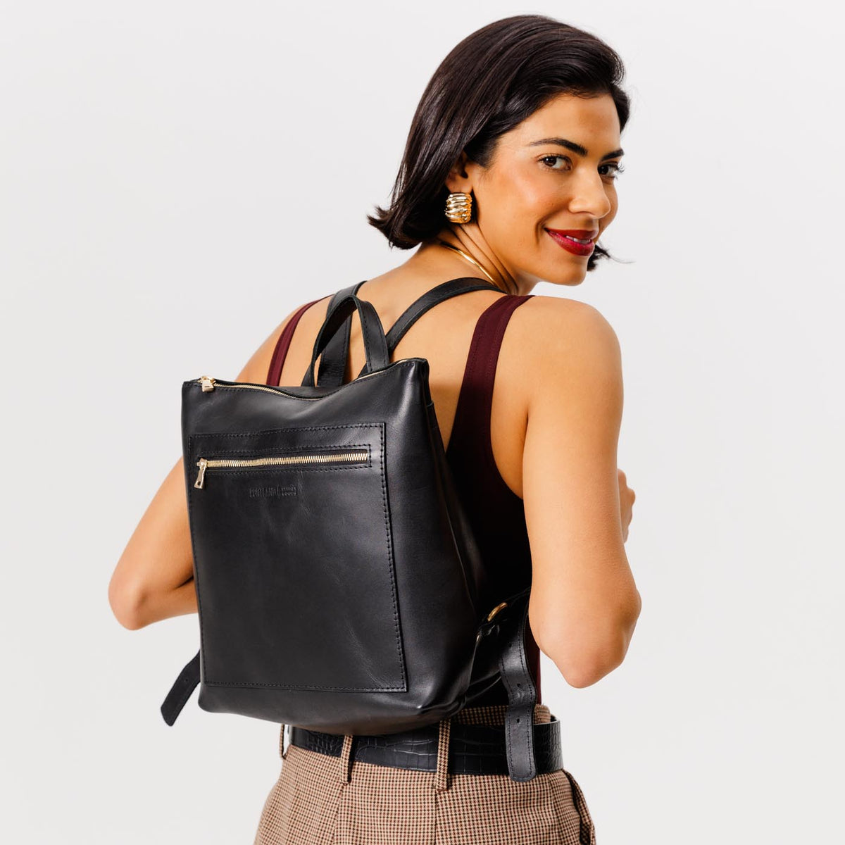 All Color: Black*Classic | Model wearing square slim leather tote backpack