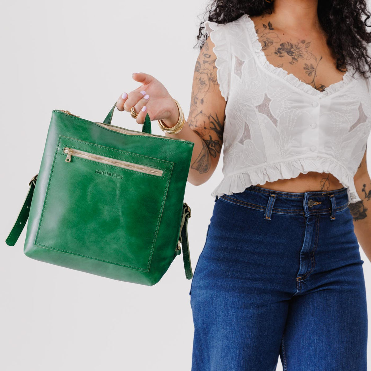 All Color: Cowboy Mint*Classic | Model holding square slim leather tote backpack